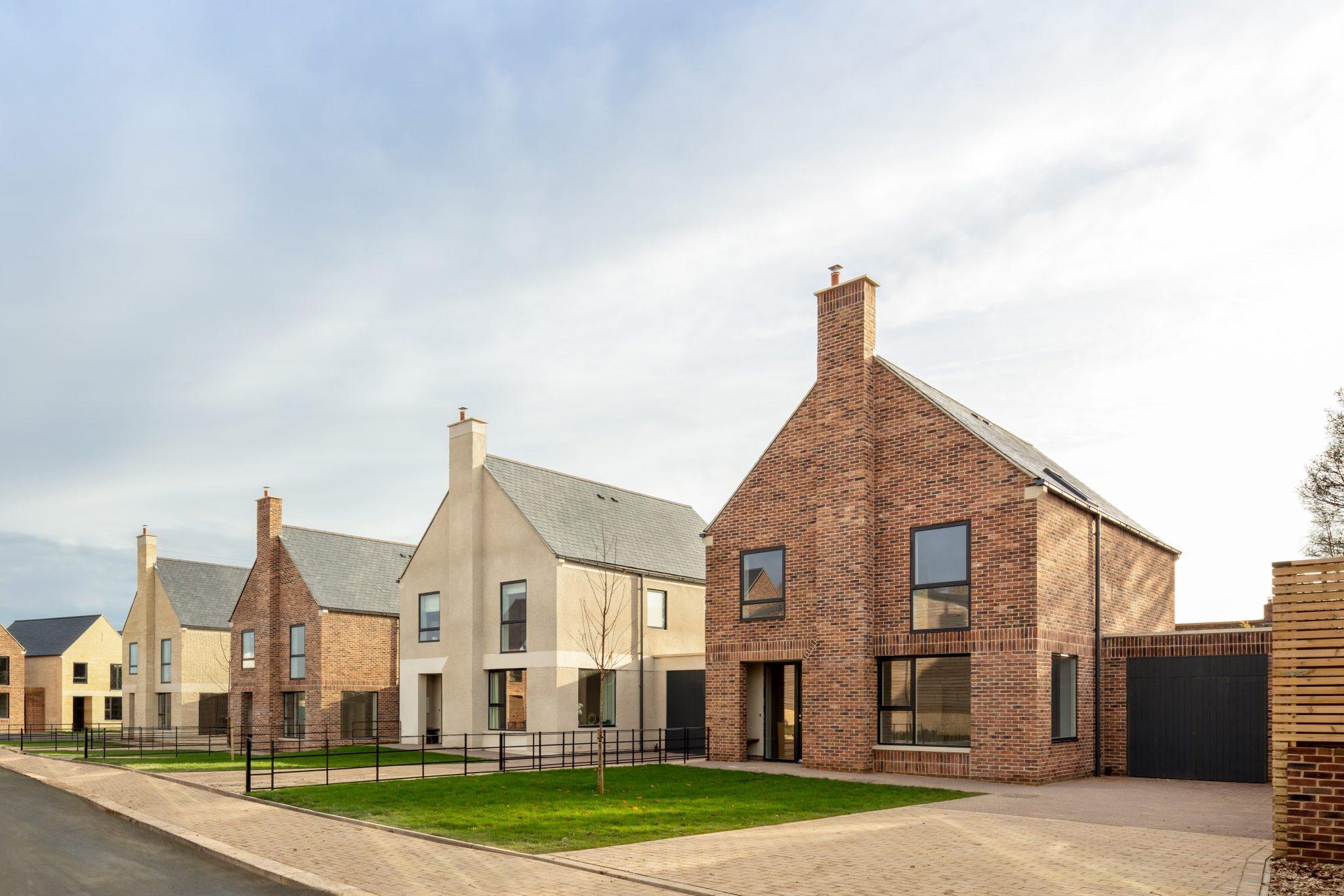 Exterior shot of new build houses in a row with space between